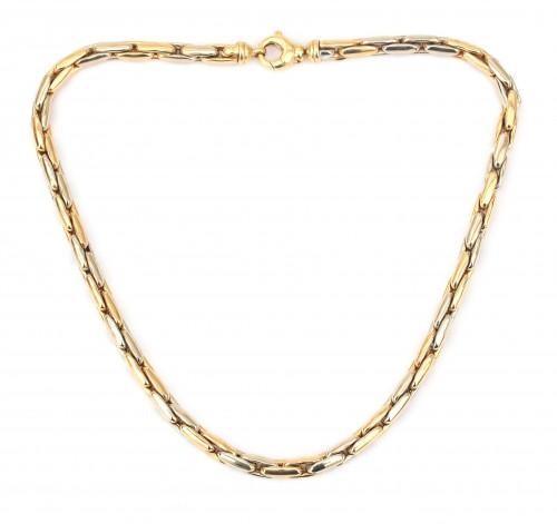 An 18 karat gold two tone necklace. Composed of enlongated yellow gold and white gold alternating links to a lobster clasp. Gross weight: 53 g.