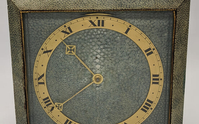 An Art Deco shagreen mantel clock, brass chapter ring,...