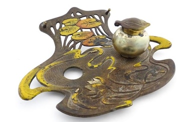 An Art Nouveau / Jugendstil cast standish of shaped form with enamel waterlily and lotus flower