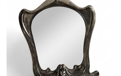An Art Nouveau Orivit polished pewter easel mirror with a ce...