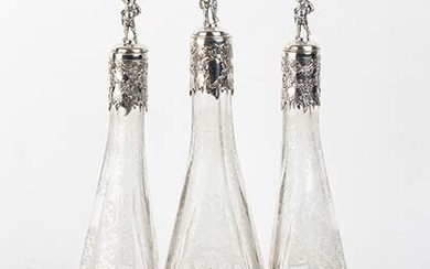 An Italian silver 800/1000 and cut glass three bottle decanter...