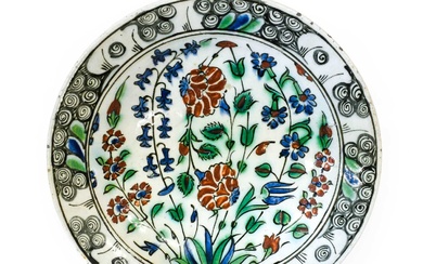 An Iznik Faience Dish, late 16th/early 17th century, painted with...