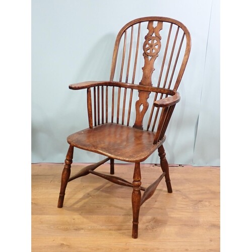 An antique ash stick back Kitchen Armchair on turned support...