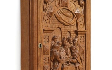 SOLD. An early 20th century oak key cabinet, richly carved with baptismal scenery in relief. H. 60. W. 41. D. 10 cm. – Bruun Rasmussen Auctioneers of Fine Art