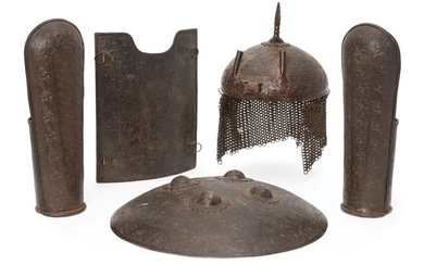An engraved steel helmet, shield, breastplate and...