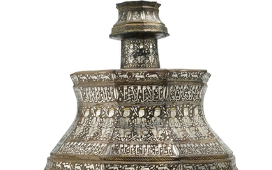 An exceptional gold and silver-inlaid brass candlestick, probably Mosul, circa 1275