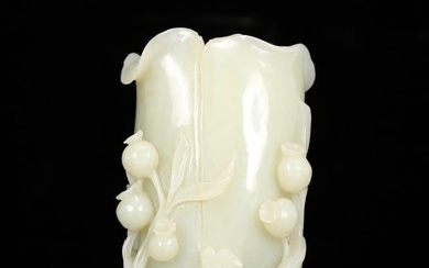 An exquisite white jade vase with floral patterns