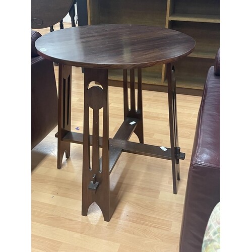 Arts and crafts circular occasional table, pierced tapering ...