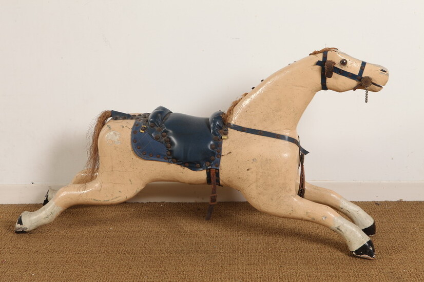 CARVED AND PAINTED FOLK FIGURE OF GALLOPING HORSE WITH BLUE...