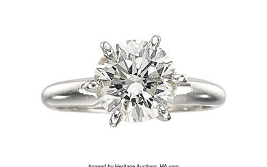 Diamond, Platinum Ring Stones: Round brilliant-cut diamond weighing 2.10...