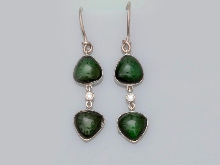 Earrings in white gold, 750 MM, each adorned with two tallow green tourmalines set with a diamond, length 3 cm, weight: 4.2gr. rough.