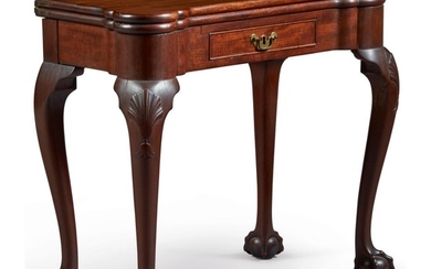FINE AND RARE QUEEN ANNE CARVED AND FIGURED MAHOGANY TURRET-TOP GAMES TABLE, PHILADELPHIA, PENNSYLVANIA, CIRCA 1750