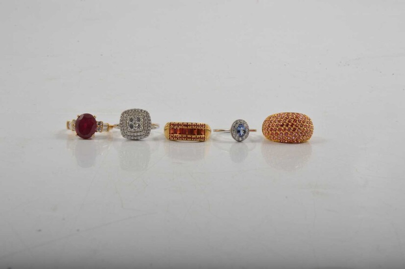 Five silver and silver-gilt gemset dress rings.