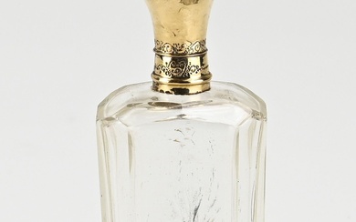 Flacon de parfum avec col et bouchon dorés, 585/000. Flacon de forme rectangulaire avec une...