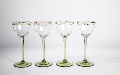 Four drinking glasses of Bohemia, circa 1910 feet and stems in green glass. Peel...