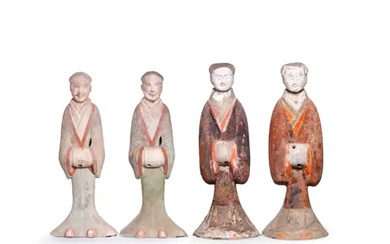 Four large Chinese pottery figures of attendants Han dynasty Each modelled standing...