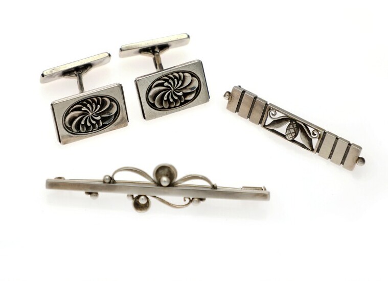 NOT SOLD. Georg Jensen: A pair of cufflinks and two brooches of sterling silver. L....