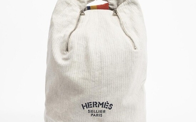 SOLD. Hermès: A "Herringbone Canvas Sling Backpack" of beige canvas with a strap and silver tone hardware. – Bruun Rasmussen Auctioneers of Fine Art