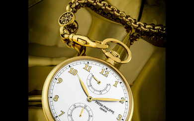 PATEK PHILIPPE. AN 18K GOLD OPEN-FACED KEYLESS LEVER POCKET WATCH WITH POWER RESERVE AND 18K CHAIN REF. 972/1J, CIRCA 2010