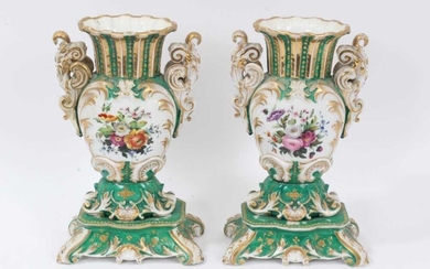 Pair of 19th century French porcelain vases, of baluster form with scrollwork handles and base, painted with floral sprays on a green gilt ground, 26cm height