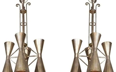 Pair of metal light fixtures in the style of Art Deco. One is chrome and the other brass.