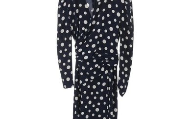Pierre Balmain: A long sleeve dress made of navy fabric with white polka dots, v neckline, belts that tie on the waist and a zipper on the back.