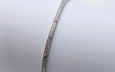 RIVER-LIKE BRACELET WITH BRILLIANT-CUT DIAMONDS AND 18K WHITE GOLD FRAME. CERTIFICATE IS ATTACHED.