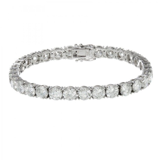 Riviere bracelet in 18kts white gold. Classic articulated model with brilliant-cut diamonds, colour G-H with...