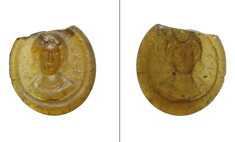 Roman yellow glass token with female bust