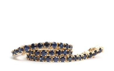 Sapphire bracelet set with numerous faceted sapphires totaling 6.94 ct., mounted in...
