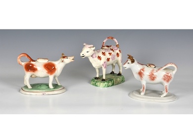 Three Staffordshire Cow Creamers, various glazes, in white, ...