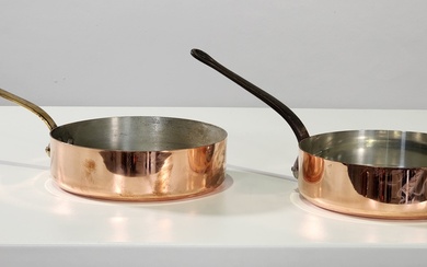 Two good quality heavy gauge pans one with brass handle...