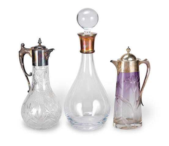 Two silver-mounted claret jugs and a decanter