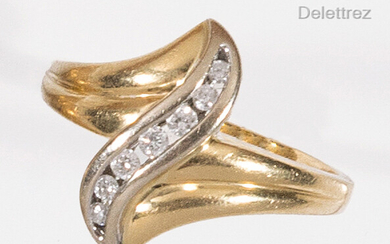 Yellow gold and white gold gadrooned ring, adorned with an...