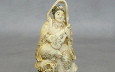 An ivory okimono: China early 20th century, young woman with...
