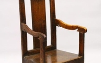 AN 18TH CENTURY OAK ARMCHAIR, with shaped cresting rail