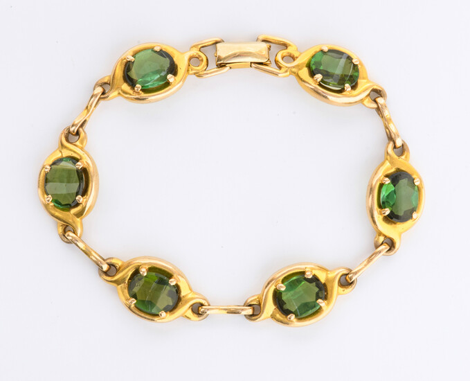 10K (STAMPED) YELLOW GOLD AND MATCHED GREEN GEMSTONE FLEXIBLE-LINK BRACELET....