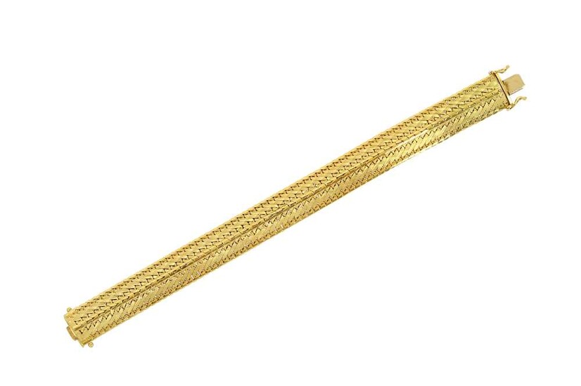 A fancy-link bracelet Composed of interlocking flattened curb links...