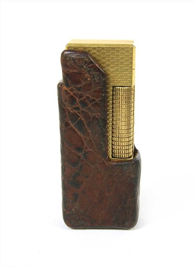 A gold plated Dunhill lighter