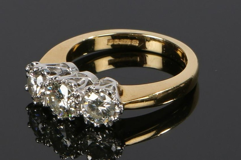18 carat gold diamond set ring, the head set with three