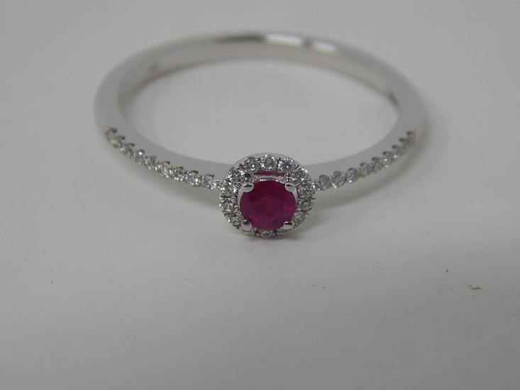 18ct white gold ruby and diamond ring, central round cut rub...