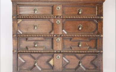 A Charles ll oak chest of drawers, having four long geometrically moulded drawers and panelled ...