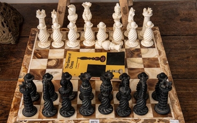 AN AGATE CHESS BOARD WITH CARVED STONE PIECES (A/F to three pieces)