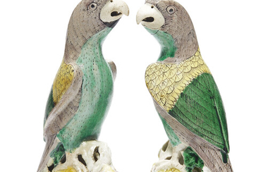 A PAIR OF BISCUIT-GLAZED PARROTS, KANGXI PERIOD (1662-1722)