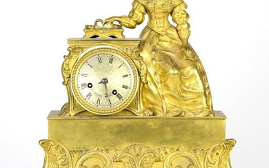 A Napoleon III gilt bronze figural mantel clock