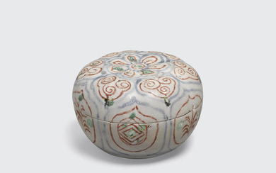 A small covered box with intricately painted underglaze blue and polychrome designs