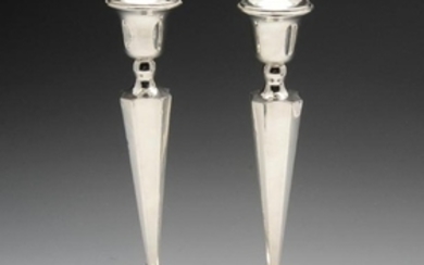 A pair of 1940's silver mounted candlesticks, each with