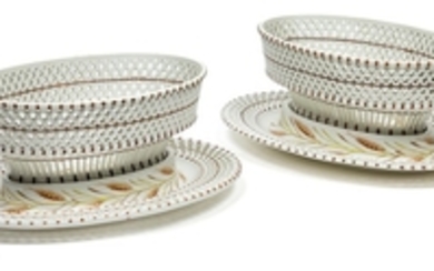 A pair of oval lattice-work baskets with presentoirs