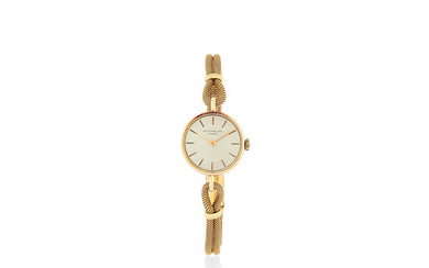 Patek Philippe. A lady's 18K gold manual wind bracelet watch