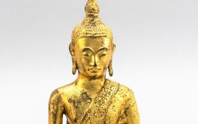 TIBETAN GILT-BRONZE FIGURE OF BUDDHA Seated in earth touching position. Height 10". Length 6".